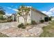 Charming home with a two-car garage, brick pavers, and manicured landscaping, creating an inviting curb appeal at 9210 Sw 60Th Court Rd, Ocala, FL 34476