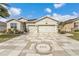 Beautiful single-Gathering home featuring a paver driveway and two-car garage in a well-maintained neighborhood at 9210 Sw 60Th Court Rd, Ocala, FL 34476