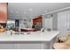 Open-concept kitchen with white countertops, stainless steel appliances, and island with barstool seating at 9210 Sw 60Th Court Rd, Ocala, FL 34476
