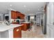 Open concept kitchen with tile flooring, wood cabinetry, stainless steel appliances, and island at 9210 Sw 60Th Court Rd, Ocala, FL 34476