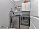 Laundry room with washer and dryer, upper cabinets and shelving at 9210 Sw 60Th Court Rd, Ocala, FL 34476
