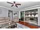 Open-concept living room with hardwood flooring, comfortable seating, and sliding glass doors at 9210 Sw 60Th Court Rd, Ocala, FL 34476