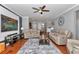 Spacious living room with wood floors, leather furniture and open floorplan at 9210 Sw 60Th Court Rd, Ocala, FL 34476