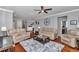 Bright and spacious living room featuring hardwood floors and modern decor at 9210 Sw 60Th Court Rd, Ocala, FL 34476