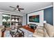 Cozy living room with wood floors, sliding glass doors and modern decor at 9210 Sw 60Th Court Rd, Ocala, FL 34476