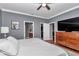 Serene bedroom with ensuite bathroom, closet, TV and neutral colors at 9210 Sw 60Th Court Rd, Ocala, FL 34476
