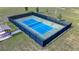 Aerial view of community pickleball court is fenced in and has shaded area for resting at 9210 Sw 60Th Court Rd, Ocala, FL 34476