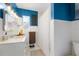 Cozy bathroom with white tile, blue walls, and a shower with a white curtain at 926 Mayfair Cir, Orlando, FL 32803