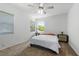 Bright bedroom with a large window and a ceiling fan, offering ample natural light and air circulation at 926 Mayfair Cir, Orlando, FL 32803