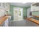 Bright kitchen with butcher block countertops, stainless steel appliances, and access to the outdoor patio at 926 Mayfair Cir, Orlando, FL 32803