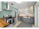 Updated kitchen featuring butcher block countertops, stainless appliances, and open layout at 926 Mayfair Cir, Orlando, FL 32803