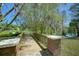 Scenic park walkway over a small bridge, featuring brick railings and views of the tranquil lake at 926 Mayfair Cir, Orlando, FL 32803
