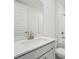 Well-lit bathroom features a modern vanity with a white countertop and white tiled shower at 2352 Citrus Bloom Dr, Bartow, FL 33830