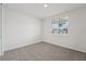 Neutral bedroom features carpet floors, a bright window, and great natural light at 2352 Citrus Bloom Dr, Bartow, FL 33830