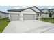 Charming single-story home with a three-car garage and a well-maintained front yard at 2352 Citrus Bloom Dr, Bartow, FL 33830