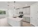 Bright kitchen with pendant lighting, white countertops, and stainless steel appliances at 2352 Citrus Bloom Dr, Bartow, FL 33830
