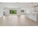 Large living room featuring a large sliding glass door, an open floor plan, and lots of natural light at 2352 Citrus Bloom Dr, Bartow, FL 33830