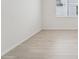 Bright room featuring wood-look flooring and white walls at 2352 Citrus Bloom Dr, Bartow, FL 33830