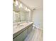 Spacious bathroom with double vanity, tile floors, and large mirror at 2834 Narcoossee Commons Way, St Cloud, FL 34771