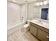 Bathroom featuring a bath tub, single vanity with gray cabinets, and white countertops at 2834 Narcoossee Commons Way, St Cloud, FL 34771