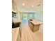Open kitchen featuring an island with a sink and dishwasher with an eat-in bar and stainless appliances at 2834 Narcoossee Commons Way, St Cloud, FL 34771