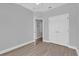 Bright bedroom with ample closet space and light-colored wood flooring at 6218 Forsythe Loop, Sanford, FL 32771