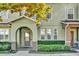 Inviting front entrance featuring an arched doorway and meticulously maintained landscaping at 6218 Forsythe Loop, Sanford, FL 32771