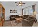 Inviting living room with hardwood floors, ceiling fan, neutral paint and plush sofas at 6218 Forsythe Loop, Sanford, FL 32771