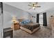 Spacious main bedroom featuring a comfortable bed, bedside tables and a ceiling fan at 6218 Forsythe Loop, Sanford, FL 32771