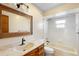 Bathroom features a bath tub, modern vanity, and updated mirror at 947 N Atmore Cir, Deltona, FL 32725