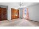 Bedroom features neutral carpet, closet, and bright window at 947 N Atmore Cir, Deltona, FL 32725