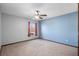 Bedroom featuring neutral carpet, ceiling fan, and natural light at 947 N Atmore Cir, Deltona, FL 32725