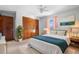 Cozy bedroom featuring ample closet space, soft lighting, and a plush rug at 947 N Atmore Cir, Deltona, FL 32725