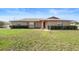 Inviting brick home featuring manicured hedges and a charming front entrance at 947 N Atmore Cir, Deltona, FL 32725