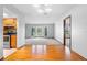 Spacious living room features hardwood floors and large bay window letting in ample natural light at 947 N Atmore Cir, Deltona, FL 32725