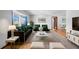 Stylishly furnished living room featuring a large window and modern decor at 947 N Atmore Cir, Deltona, FL 32725
