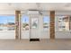 Sunroom featuring brick accents, windows, and a charming glass-accented door to the backyard at 947 N Atmore Cir, Deltona, FL 32725