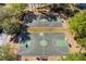 Overhead shot of community basketball courts with shade trees at 1056 Royal Saint George Dr, Orlando, FL 32828