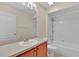 Bathroom featuring a vanity, mirror, bath tub and tiled shower at 1056 Royal Saint George Dr, Orlando, FL 32828