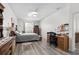 Bright bedroom with hardwood floors, a ceiling fan, and a window at 1056 Royal Saint George Dr, Orlando, FL 32828