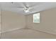 Neutral bedroom featuring a ceiling fan with light and a window with blinds at 1056 Royal Saint George Dr, Orlando, FL 32828