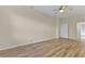 Spacious bedroom boasts wood-look floors and neutral paint, offering a calming retreat at 1056 Royal Saint George Dr, Orlando, FL 32828