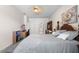 Bright bedroom featuring a ceiling fan, a full-sized bed, a work desk, and an elegant decorative wall print at 1056 Royal Saint George Dr, Orlando, FL 32828