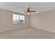 Neutral bedroom featuring a ceiling fan with light and a window at 1056 Royal Saint George Dr, Orlando, FL 32828