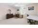 Bedroom with sewing machine, dresser, table, and waterfall decor creates a craft-friendly and inviting space at 1056 Royal Saint George Dr, Orlando, FL 32828