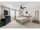 Bright bedroom featuring a ceiling fan, neutral walls, and carpet flooring at 1056 Royal Saint George Dr, Orlando, FL 32828