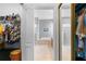 Walk-in closet transitions to a serene bathroom, complete with a soaking tub and a glass-enclosed shower at 1056 Royal Saint George Dr, Orlando, FL 32828