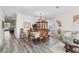 Elegant dining room showcasing hardwood floors, a chandelier, and ample space for gatherings at 1056 Royal Saint George Dr, Orlando, FL 32828
