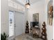 Inviting entryway featuring stylish decor, a tiled floor, and a bright window for natural light at 1056 Royal Saint George Dr, Orlando, FL 32828