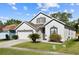 Charming home with a well-manicured lawn and two-car garage at 1056 Royal Saint George Dr, Orlando, FL 32828